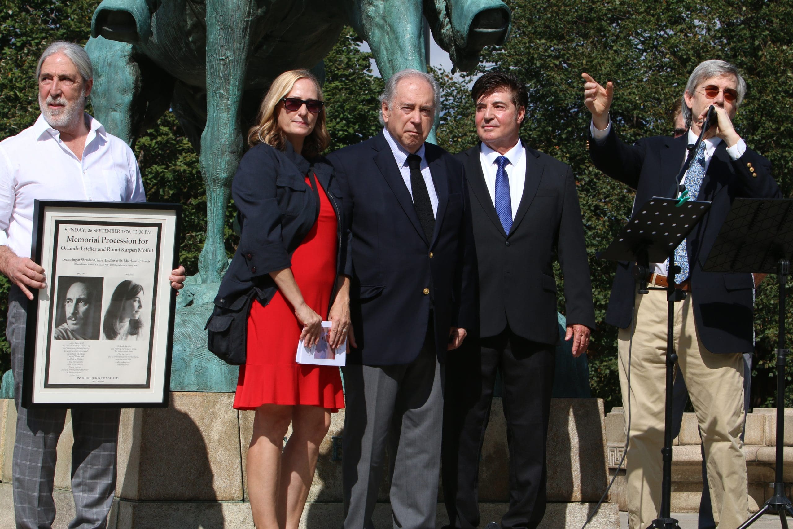 From left to right: Juan Pablo Letelier, Sarah Anderson, Chilean Ambassador Juan Gabriel Valdés, Cristian Letelier, and John Cavanagh, site of the 1976 assassination of Orlando Letelier and Ronni Karpen Moffitt, Sheridan Circle, Washington, DC, September 28, 2025. (Credit: Rick Reinhard.)